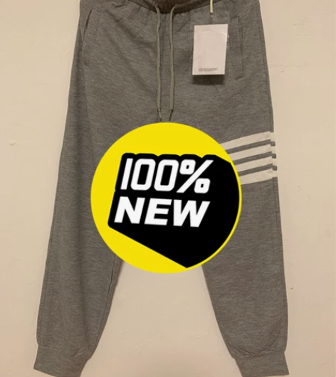 灰色M码男女情侣同款休闲运动长裤，包装吊牌...