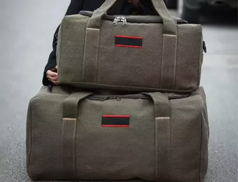 手提旅行包帆布大包长途行李包袋男出差耐磨旅...