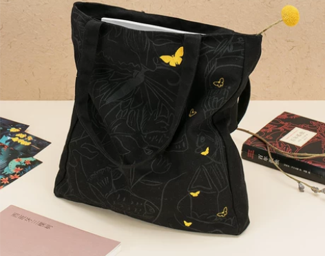 ?百年孤独刺绣蝴蝶女单肩拉链帆布包小众手提...