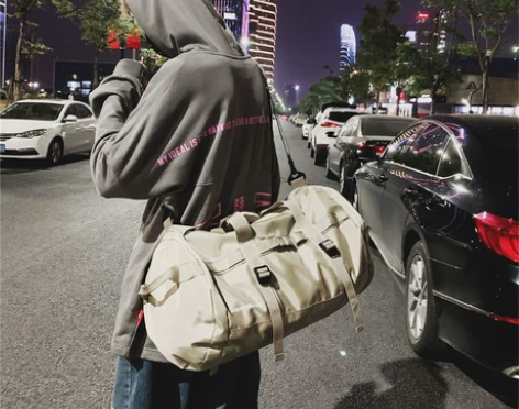 帆布旅行包男手提网红行李包女短途大容量轻便...