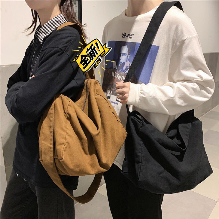 港风斜挎包男士帆布单肩包女生休闲百搭背包2...