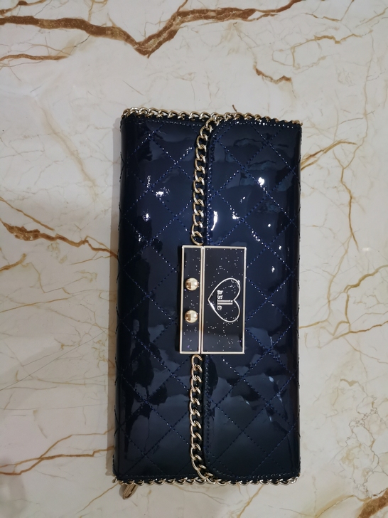 深蓝色女士手包,全新。长20cm。