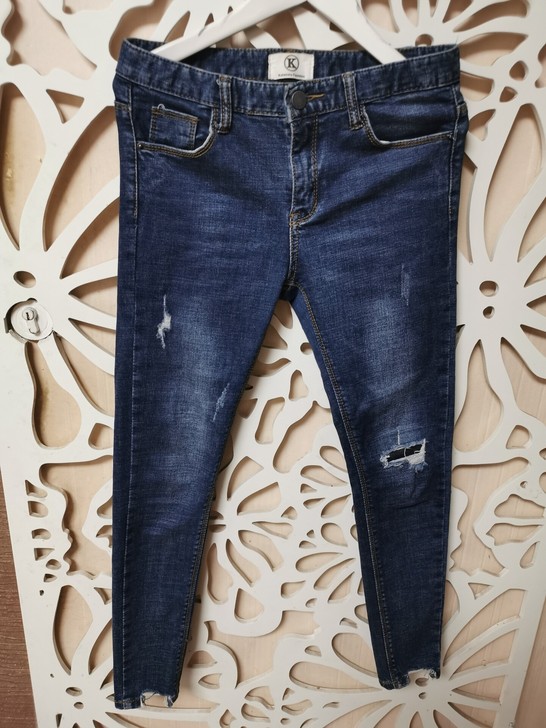 卡兰秀深蓝色破洞毛边牛仔裤小脚裤