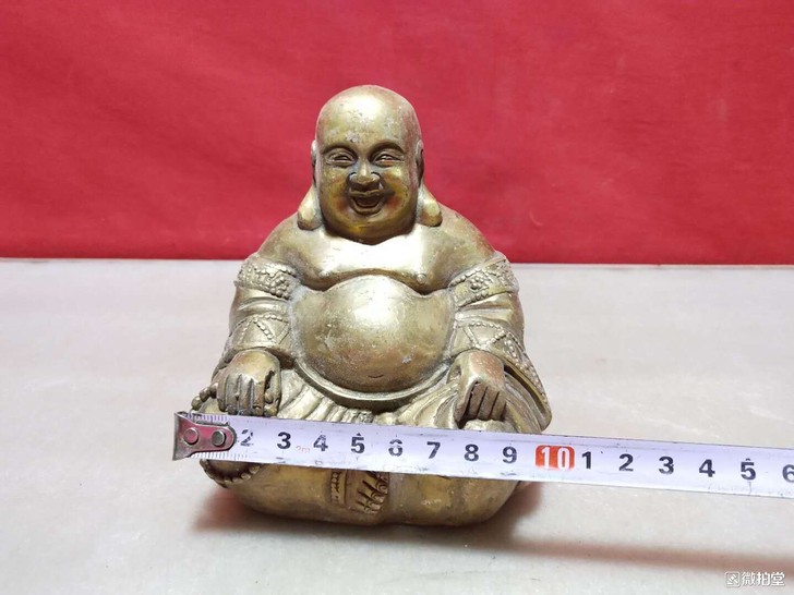 铜佛像，重1.3斤。