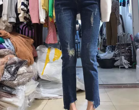 韩国东大门秋季新款中腰显瘦磨毛破洞不规则牛...