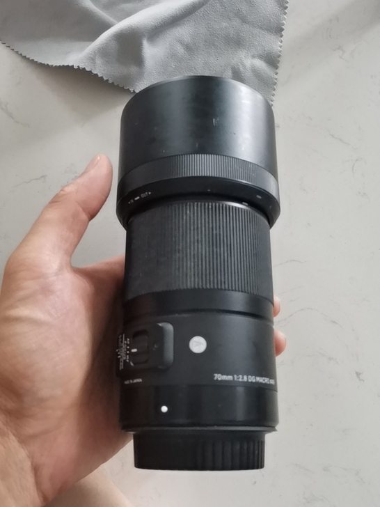 适马70微距DG内部微灰不影响成像质量，镜...