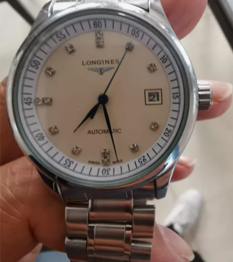 出一块机械浪琴手表,手表运行一切正常,非常...