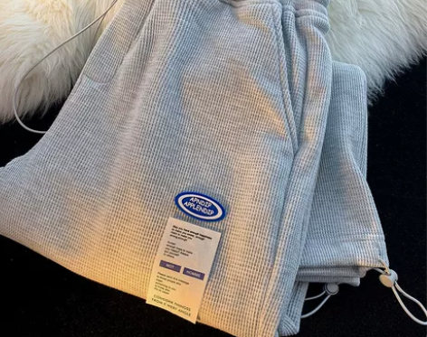 初春新款华夫格卫裤男时尚贴标抽绳束脚哈伦裤...