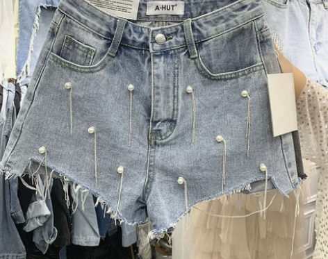 夏装新款个性立体钉珠流苏牛仔短裤女毛边显瘦...