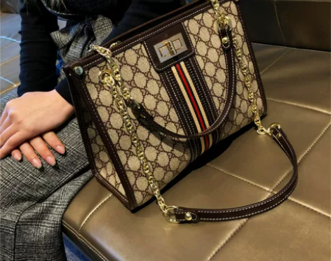 单肩包手提香港品牌包包女2022新款潮真皮...