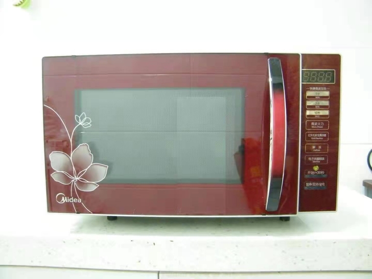 美的微波炉九成新功能一切正常使用方便简单热...