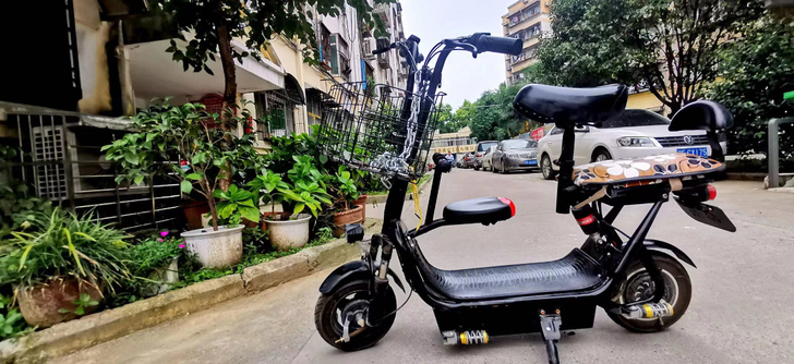 典鸽拼夕夕拼的亲子电动车