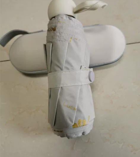 五折黑胶防晒手动伞    烫金奶白色