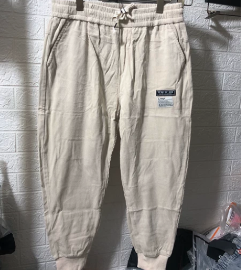 全新精品条绒男士米色宽松版型休闲9分裤特价...