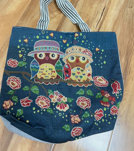 闲置全新环保布艺书包一个，图案设计很漂亮哦...