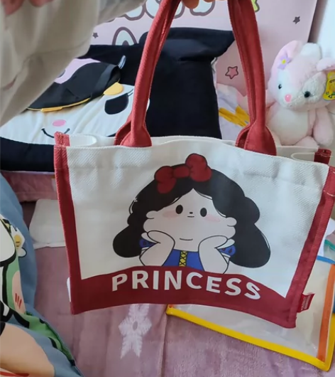 卡通胖公主帆布手提包女上班时尚百搭小手拎袋...