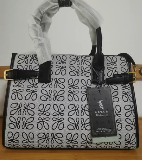 啄木鸟女士手提包可单肩斜挎，人字纹内里，里...