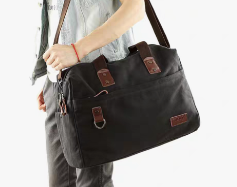 转卖欧美潮流男包帆布包单肩包户外大容量旅行...