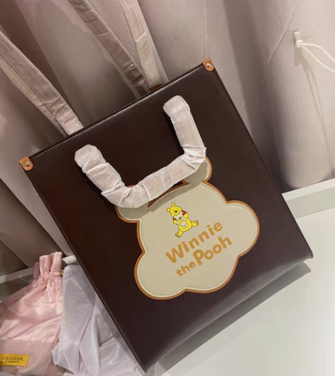 包邮不莱玫迪士尼维尼熊托特包新款包包大容量...