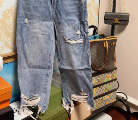 包邮蓝色破洞脚口流苏牛仔裤女 尺码31 感...