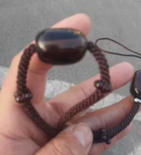 纯手工编织手机挂绳 两颗茶水晶，十六颗石榴...