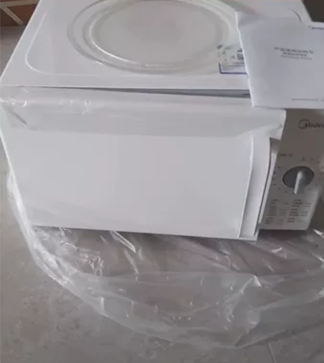 转让全新美的M100微波炉家用转盘式机械多...