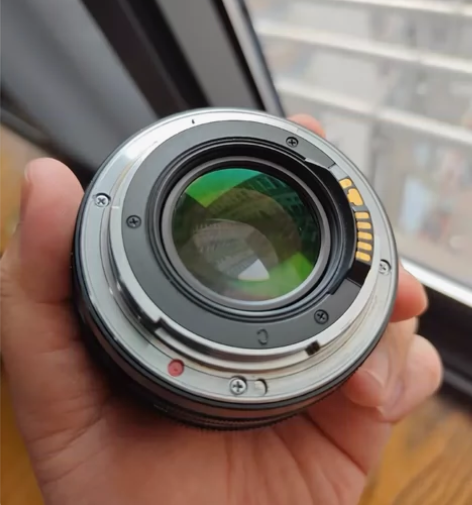 蔡司50佳能口，镜片都没事，漆有些掉，外观...