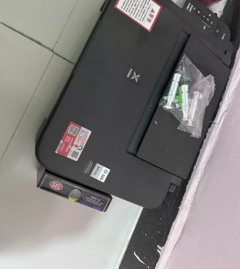佳能喷墨彩色打印机，现在打印不清晰，换个墨...